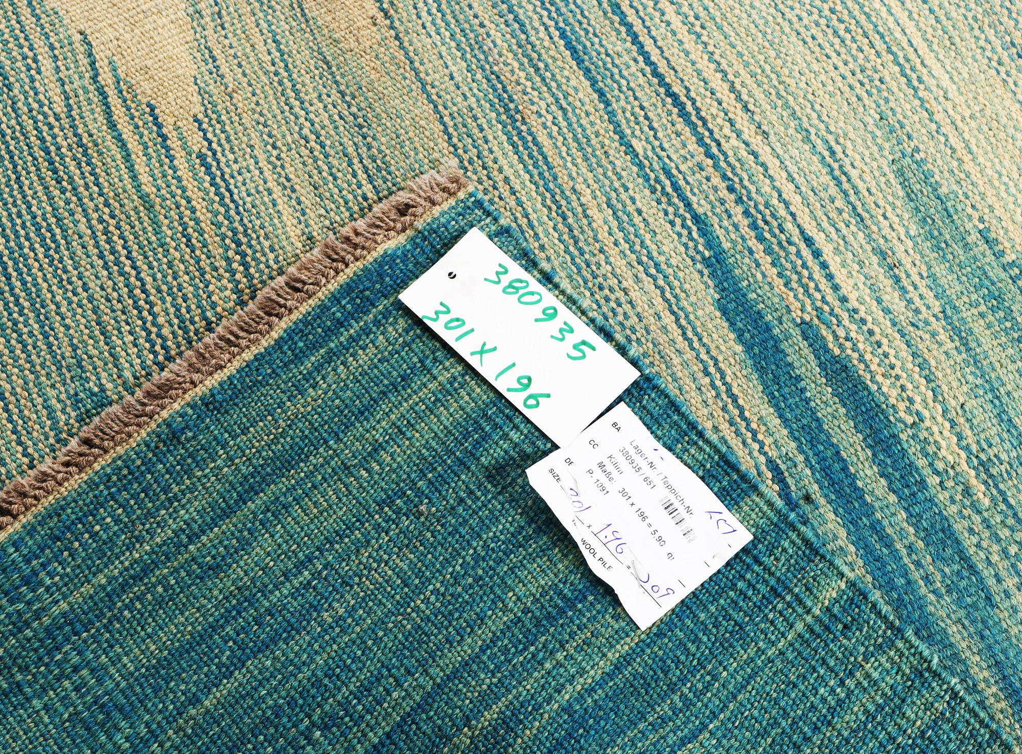 A Kilim carpet, c. 301 x 196 cm.