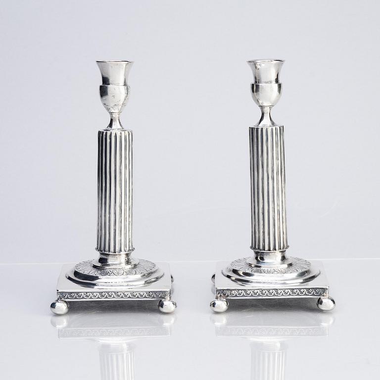 A pair of Gustavian silver candlesticks, unclear maker's mark, the cuffs with mark of Pehr Zethelius, Stockholm 1796.