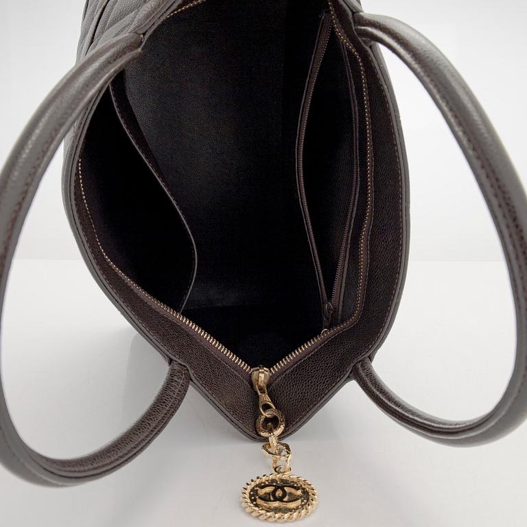 Chanel, a "Medallion Tote" bag.