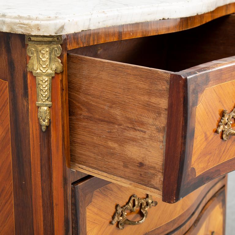 A Louis XV style chest of drawers, probably France, second half of the 19th century.