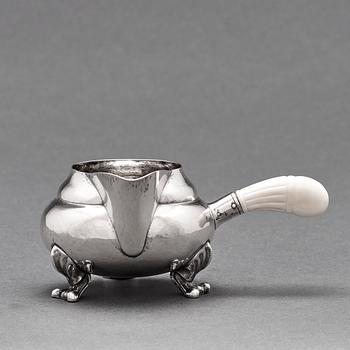 Georg Jensen, a three pieces coffee and tea service, "Blossom", Copenhagen Denmark 1915-21 830/1000 silver. Design nr 2,