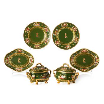 A pair of armorial butter tureens with covers and stands and two fruit dishes, Derby, England, circa 1830.