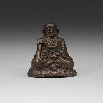 194. A copper alloy figure of a Lama, Tibet, 18th Century.