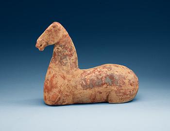 A pottery figure of a horse, Han dynasty (206 BC - 220 AD).