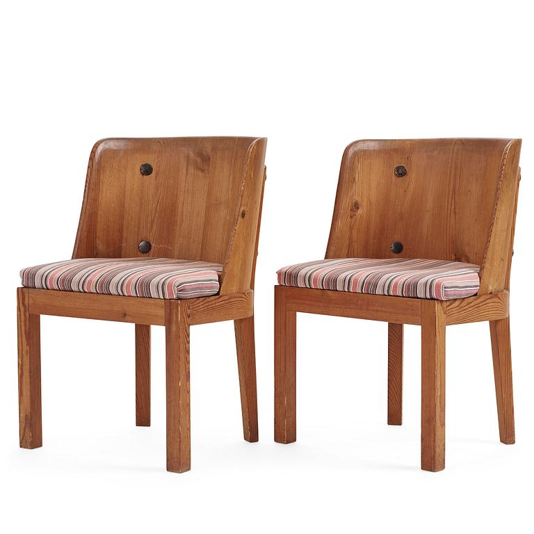 Axel Einar Hjorth, a pair of stained pine "Lovö" armchairs, Nordiska Kompaniet,  Sweden, 1930s.