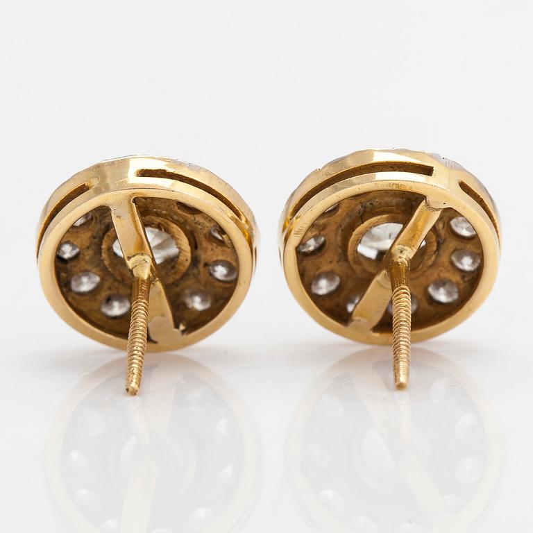 A pair of 18K white/yellowgold earrings set with brilliant cut diamonds approx. 3.40 ct in total. With certificate.