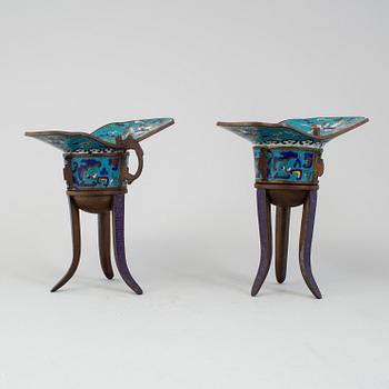 A pair of chinese cloisonné tripod wine vessels, 20th century.