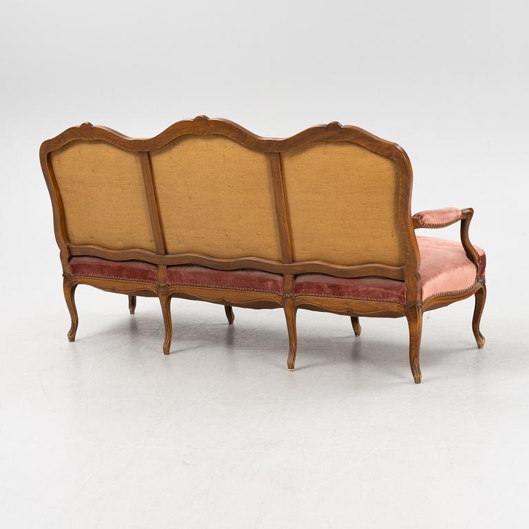 A rococo style sofa, end of the 20th Century.