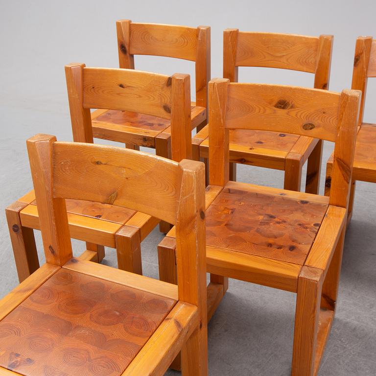 A set of six mid 20th century pine wood chairs with wheels.