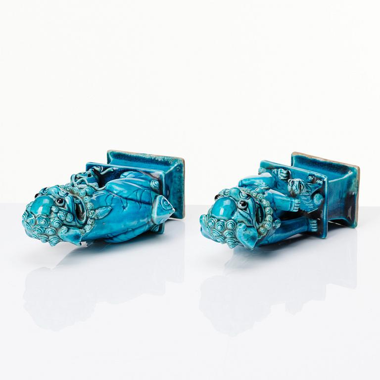 A pair of Chinese turquoise glazed buddhist lions, Qing dynasty, 18th Century.