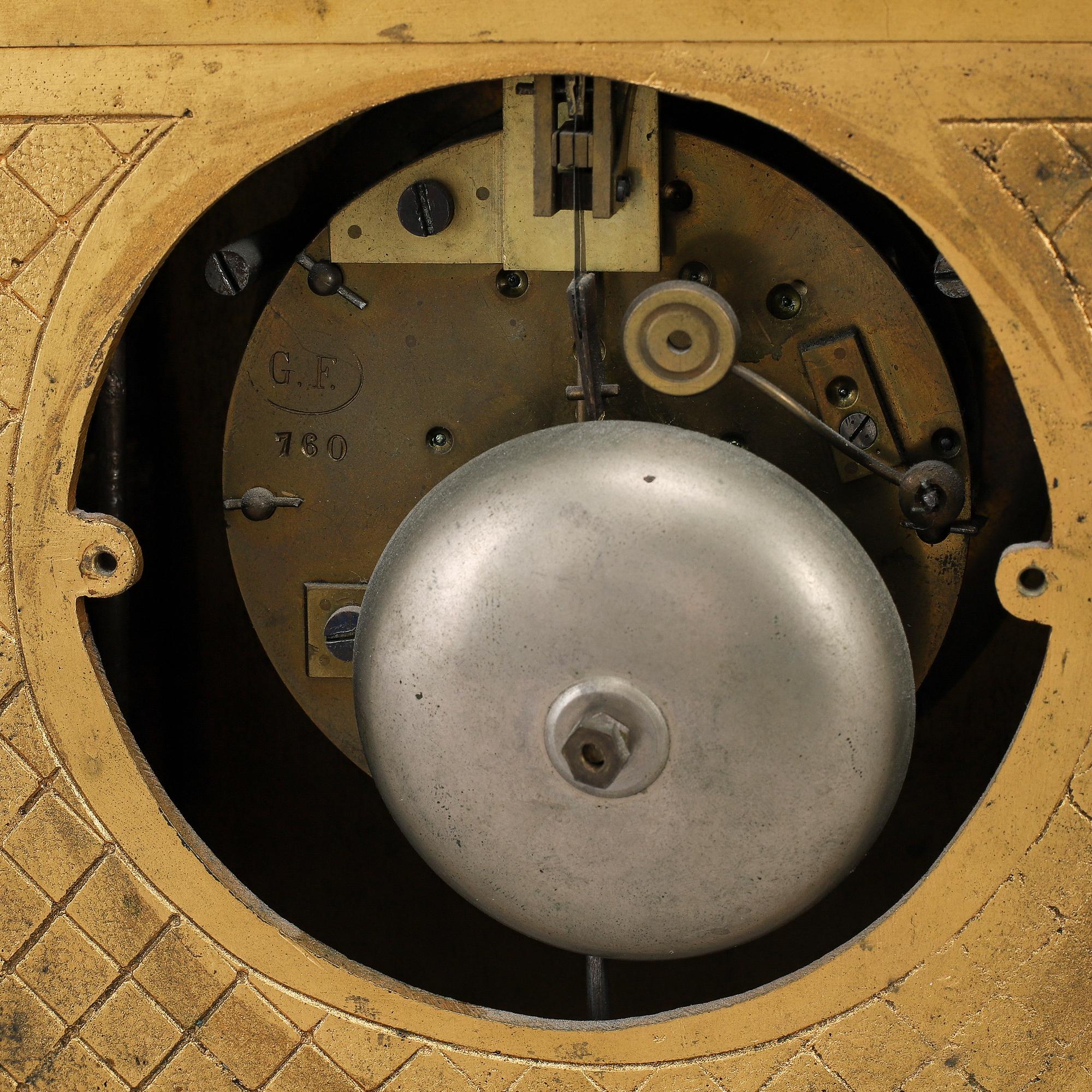 A late 19th Century bronze and porelain mantel clock.