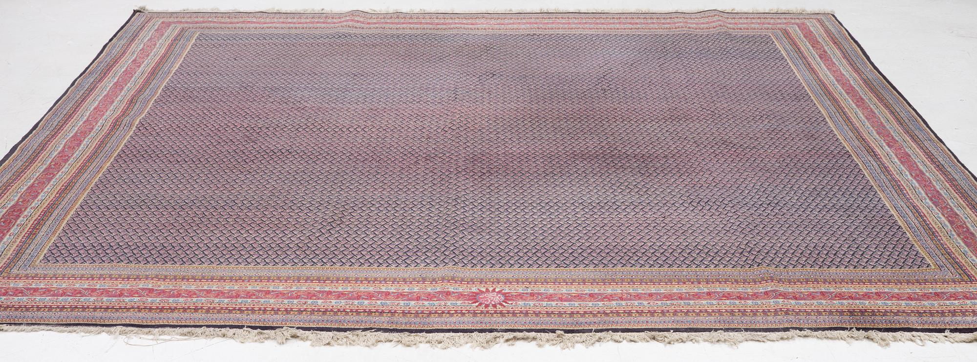 A oriental carpet, signed, c. 295 x 295 cm.