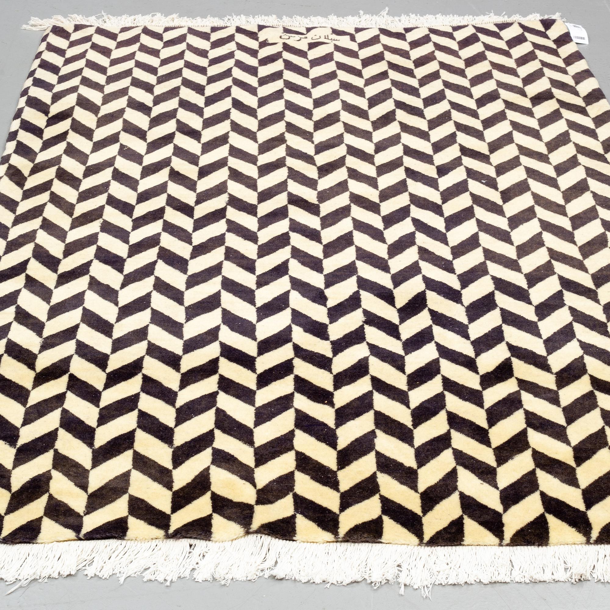 A persian rug, around 230 x 149 cm.