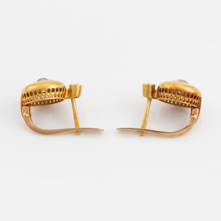 A pair of 18K gold earrings set with old-cut diamonds.