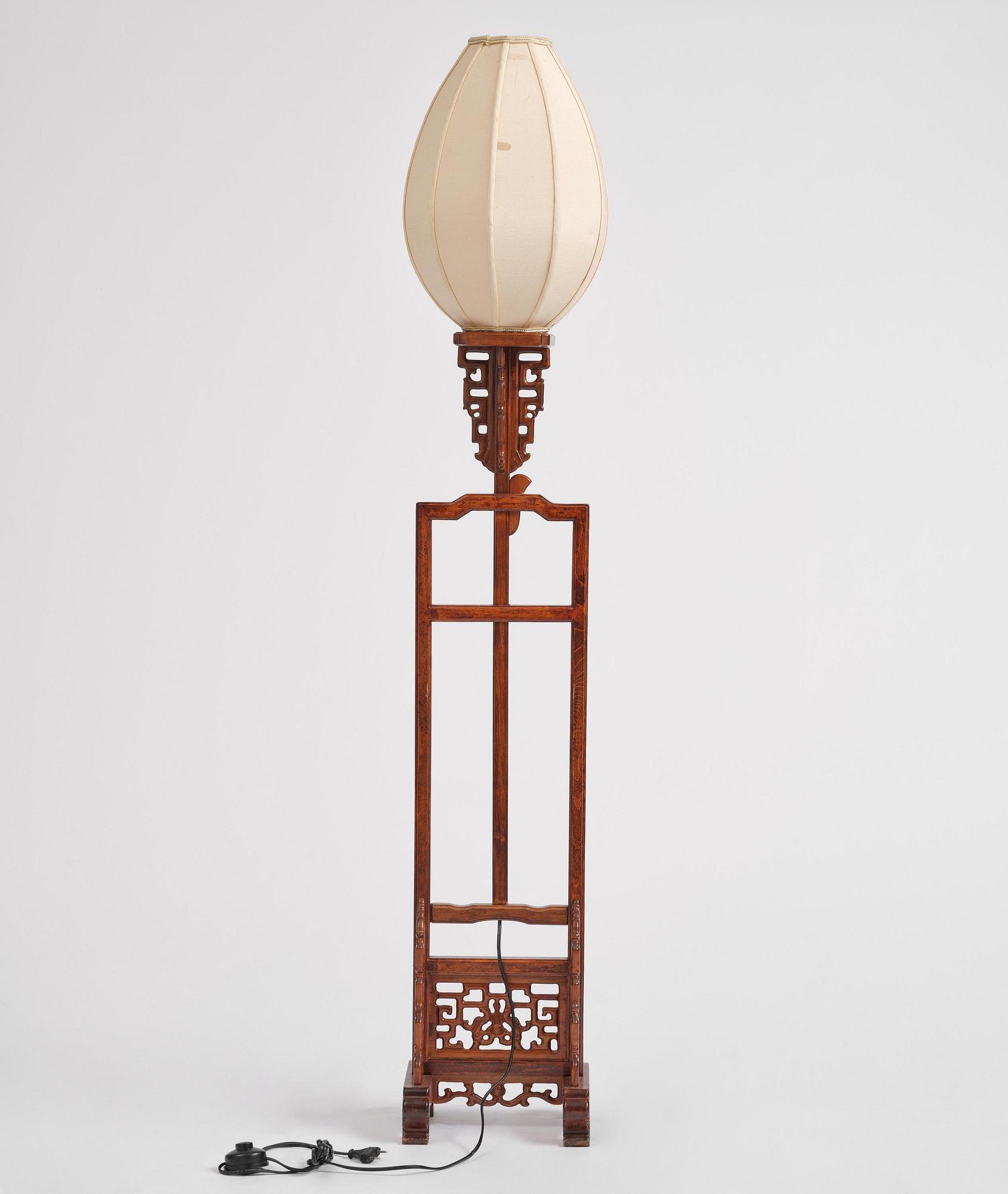 A Chinese wooden floor lamp, later part of the 20th century.
