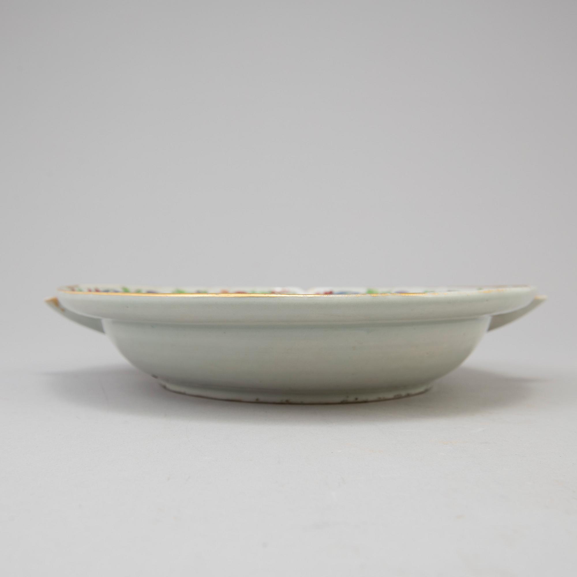 Three chinese famille rose dishes and one hot water dish, 18th and 19th century.