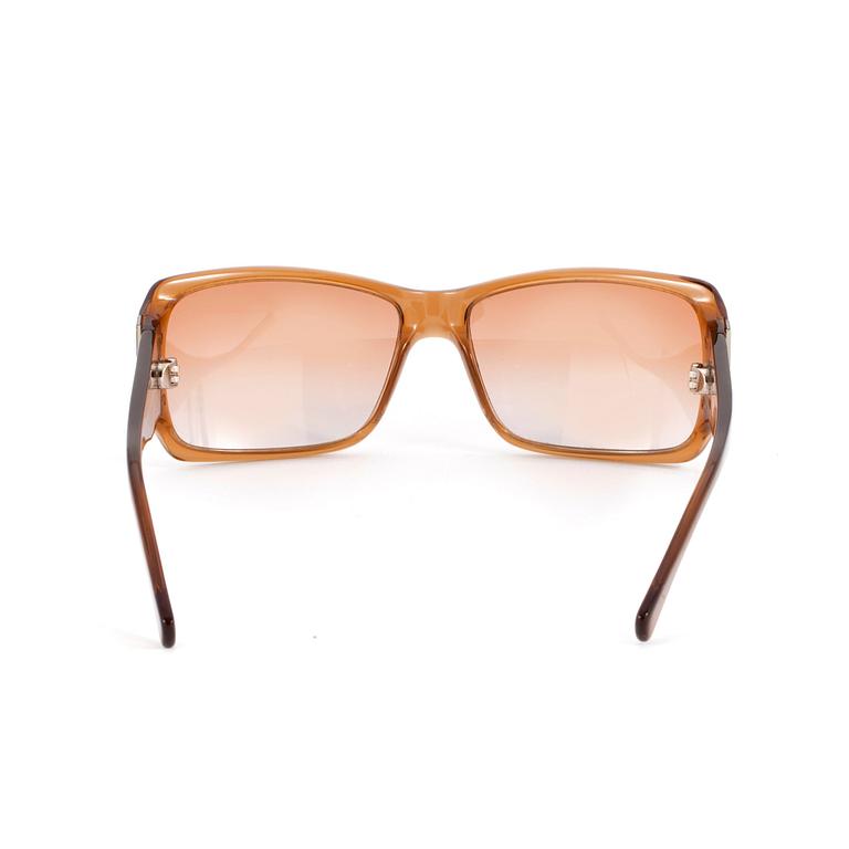 YVES SAINT LAURENT, a pair of sunglasses.