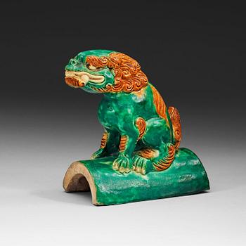 A sancai glazed roof tile figure of a mythological animal, Ming dynasty, 17th Century.