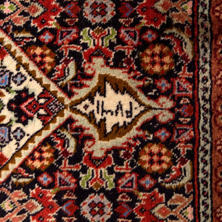 An old Bidjar runner signed and dated 320x88 cm.