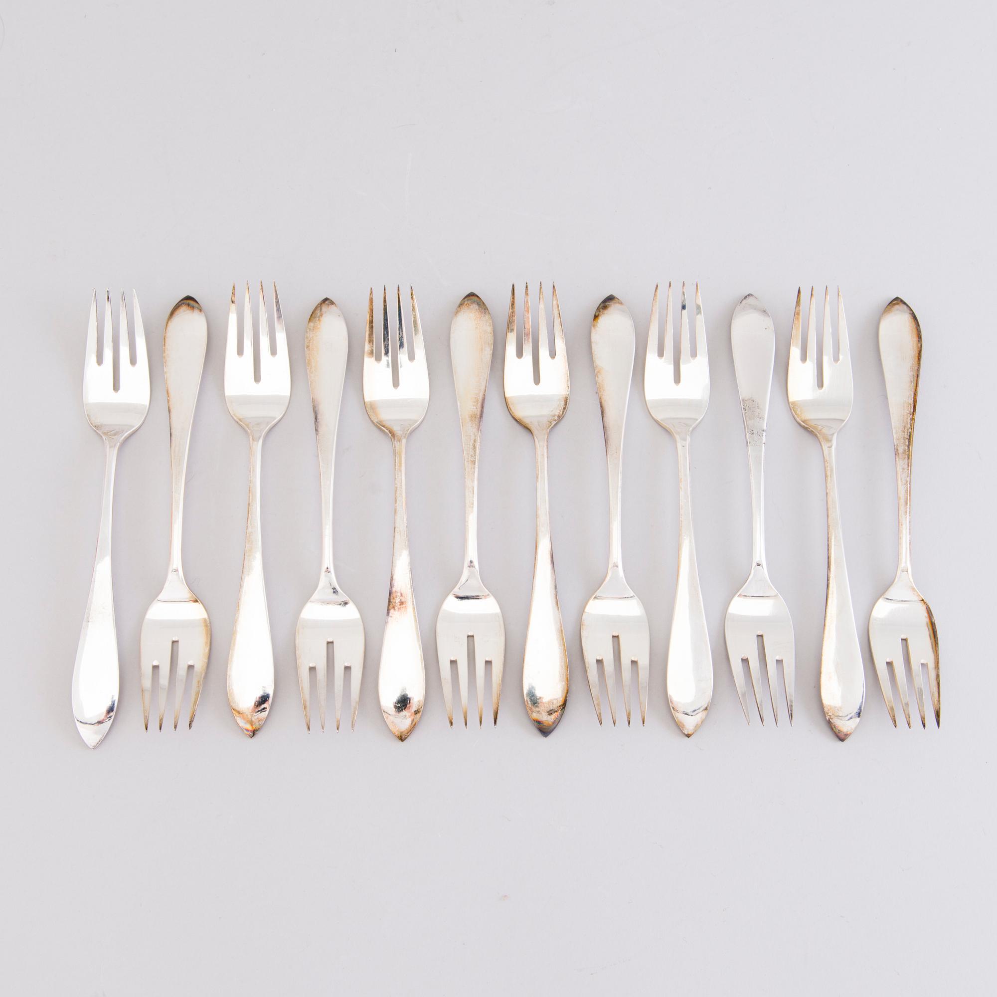 A 1920s 88-piece set of silver cutlery and 12 knife handles, Warsaw Poland.
