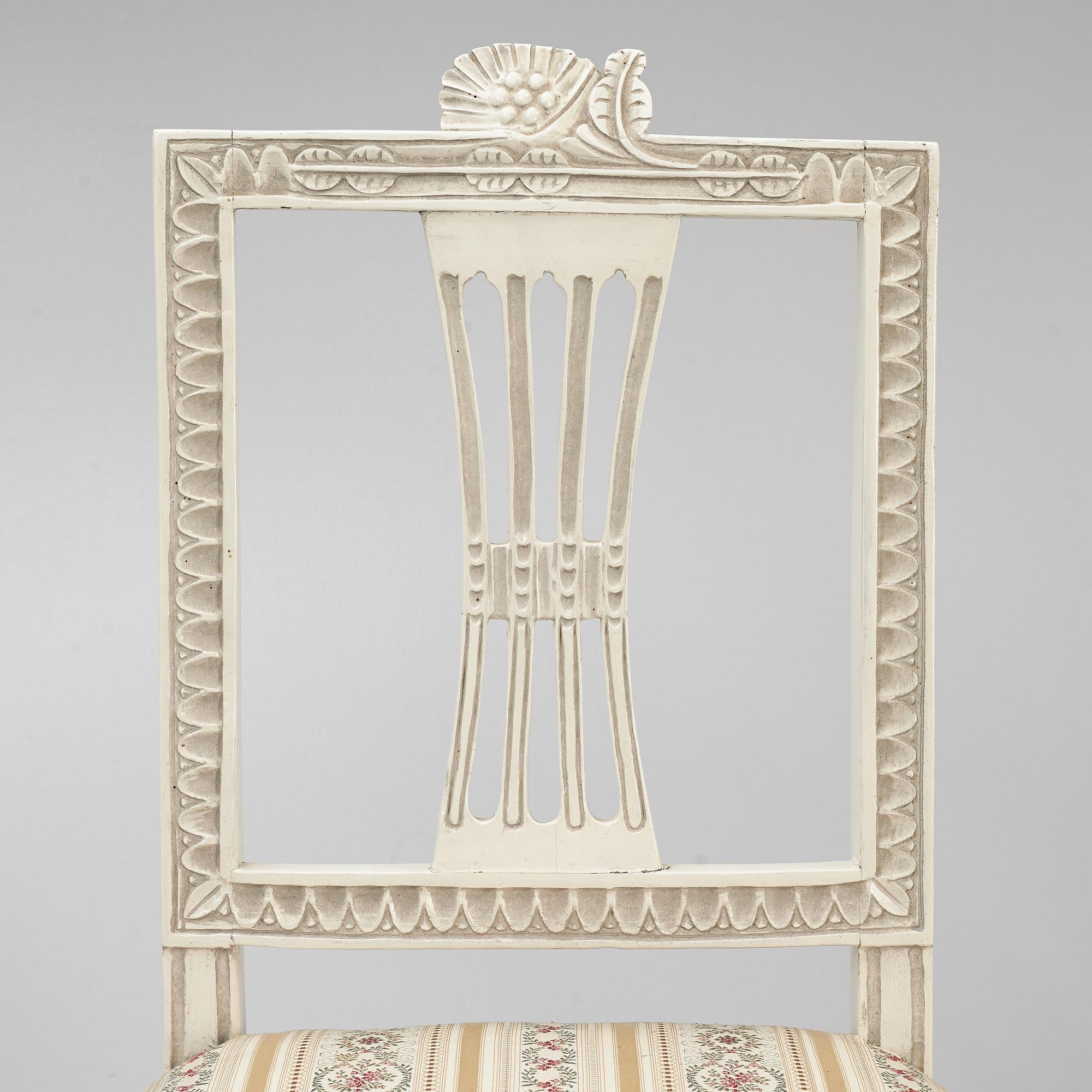 A sofa, three chairs and a table, Gustaivan style and of the Gustavian period, 19th-20th century.