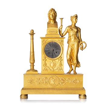 141. A French Empire ormolu mantel clock, early 19th century.