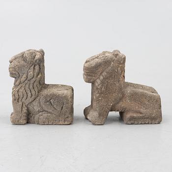 A set of two lion garden sculptures.