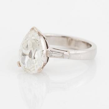 A platinum ring set with a pear shaped old-cut diamond weight ca 3.00 cts quality ca I si2.