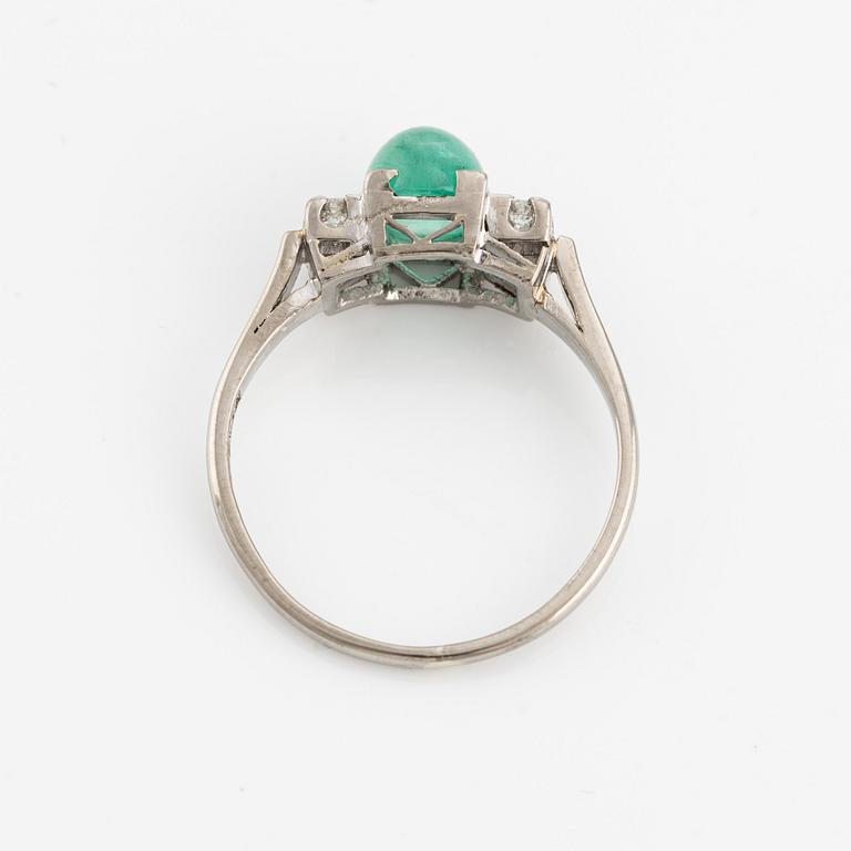 Ring, 18K white gold with cabochon-cut emerald and brilliant-cut diamonds.