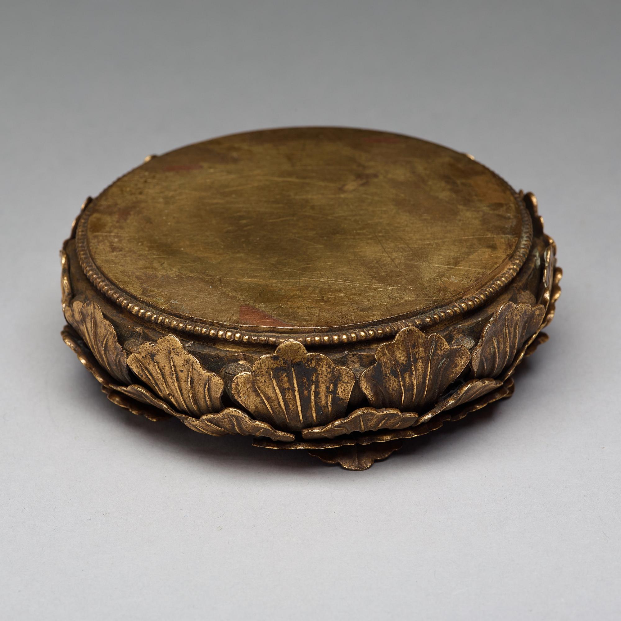 A gilt copper alloy stand/ritual object, 18th Century, probably Mongolian.