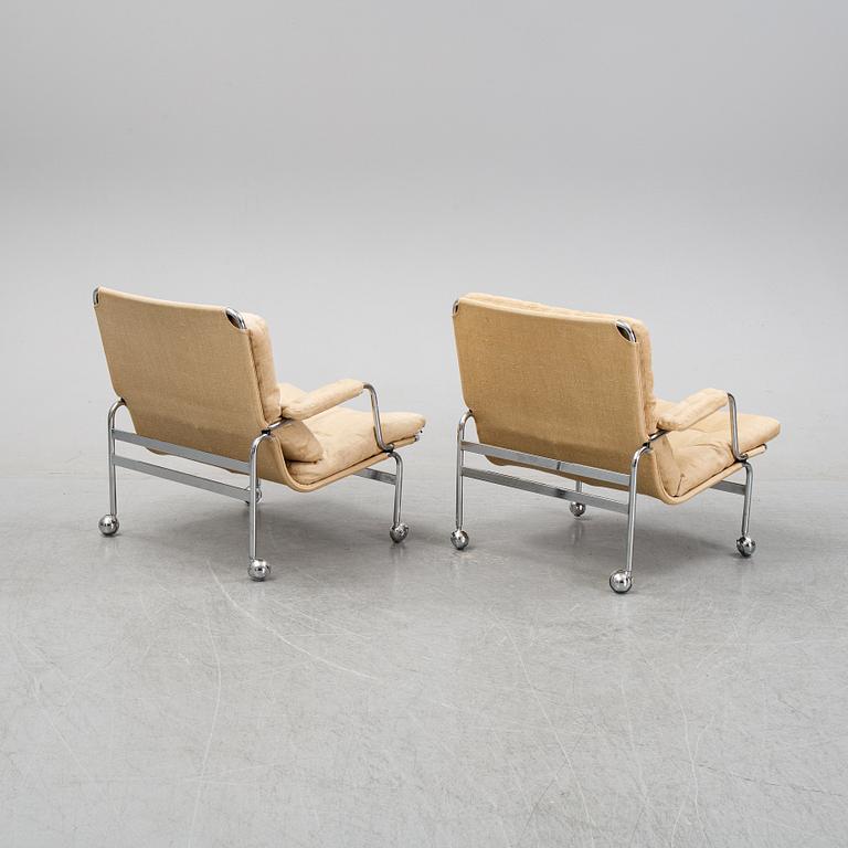Bruno Mathsson, a pair of easy chairs and a coffee table, 'Karin', Dux, second half of the 20th Century.