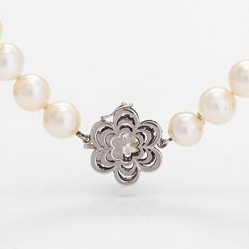 A cultured saltwater pearl necklace, clasp in 18K white gold with an old mine-cut and single-cut diamonds.