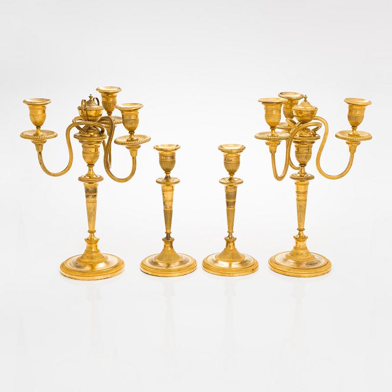 A pair of early 19th century French candelabrums and candlesticks.