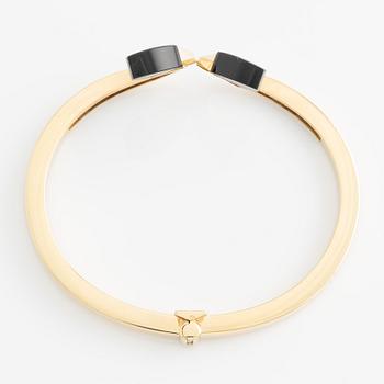 Bangle with onyx and brilliant-cut diamonds.