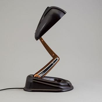 a bakelite and metal table 'Bolide' table lamp, by JUMO, 1940's.