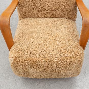 Fåtölj med fotpall, 1900-talets första hälft.