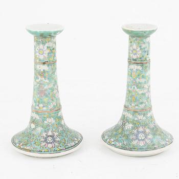 A pair of Chinese porcelain candle sticks, Qing dynasty, 19th century.