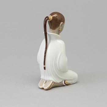 An Arno malinowski porcelain figure 'Opiumsmoker', for Royal Copenhagen, Denmark, 1920s.