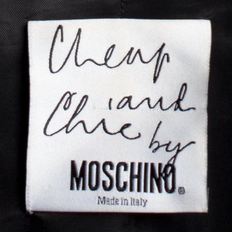 MOSCHINO CHEAP AND CHIC, a grey chequered wool jacket.