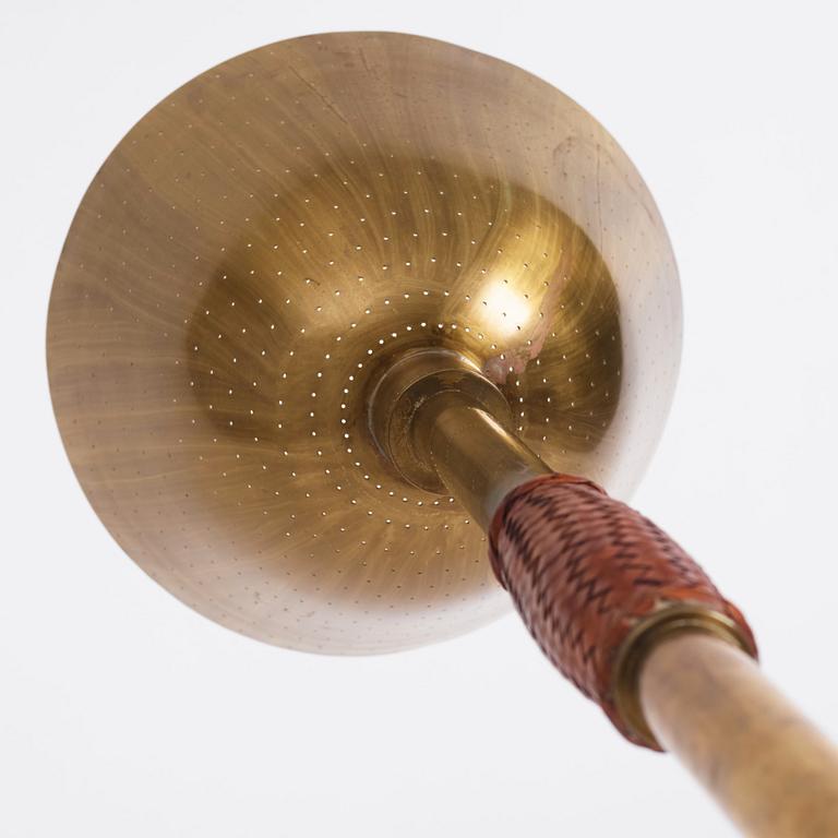 Carl-Axel Acking, a brass and leather floor lamp, designed for the Stockholm Association of Crafts in 1939.