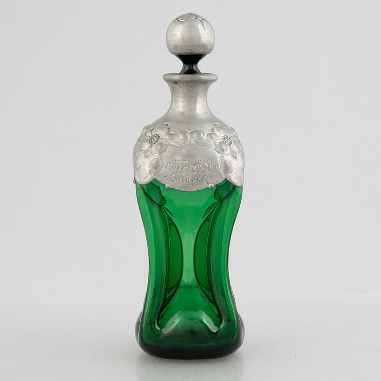 A green glass bottle with stopper, Sweden, early 20th century.