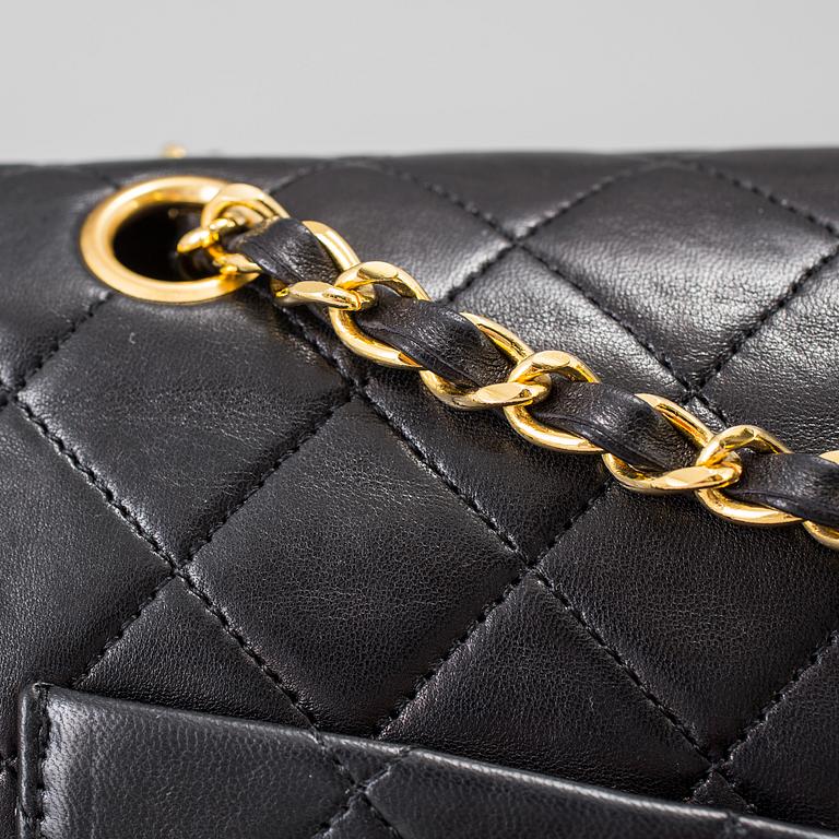 A "Double Flap bag" by Chanel.