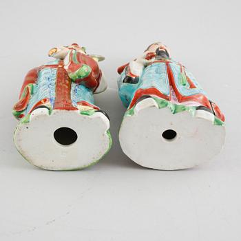 A pair of chinese figurines.