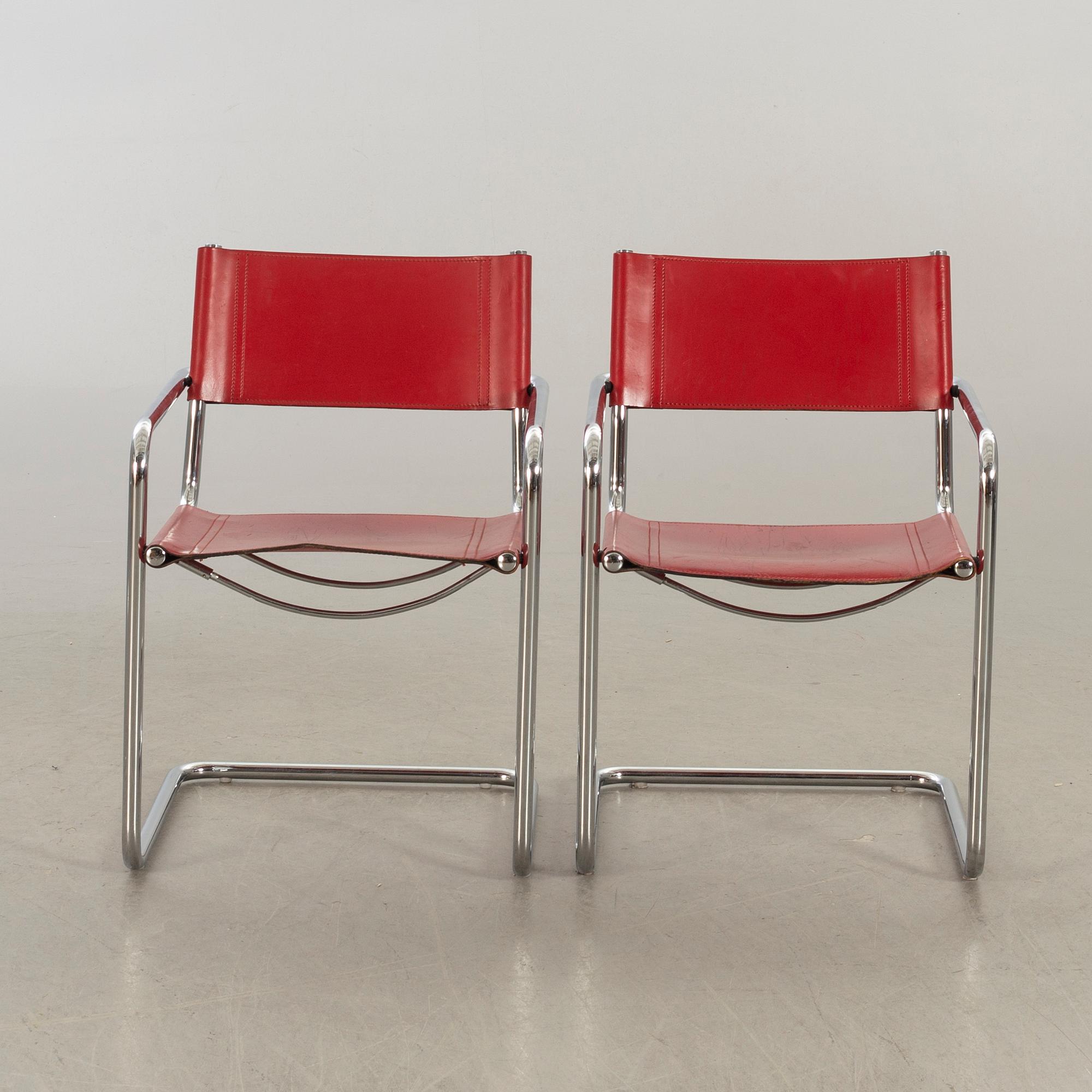 A pair of 20th century later part  armchairs.