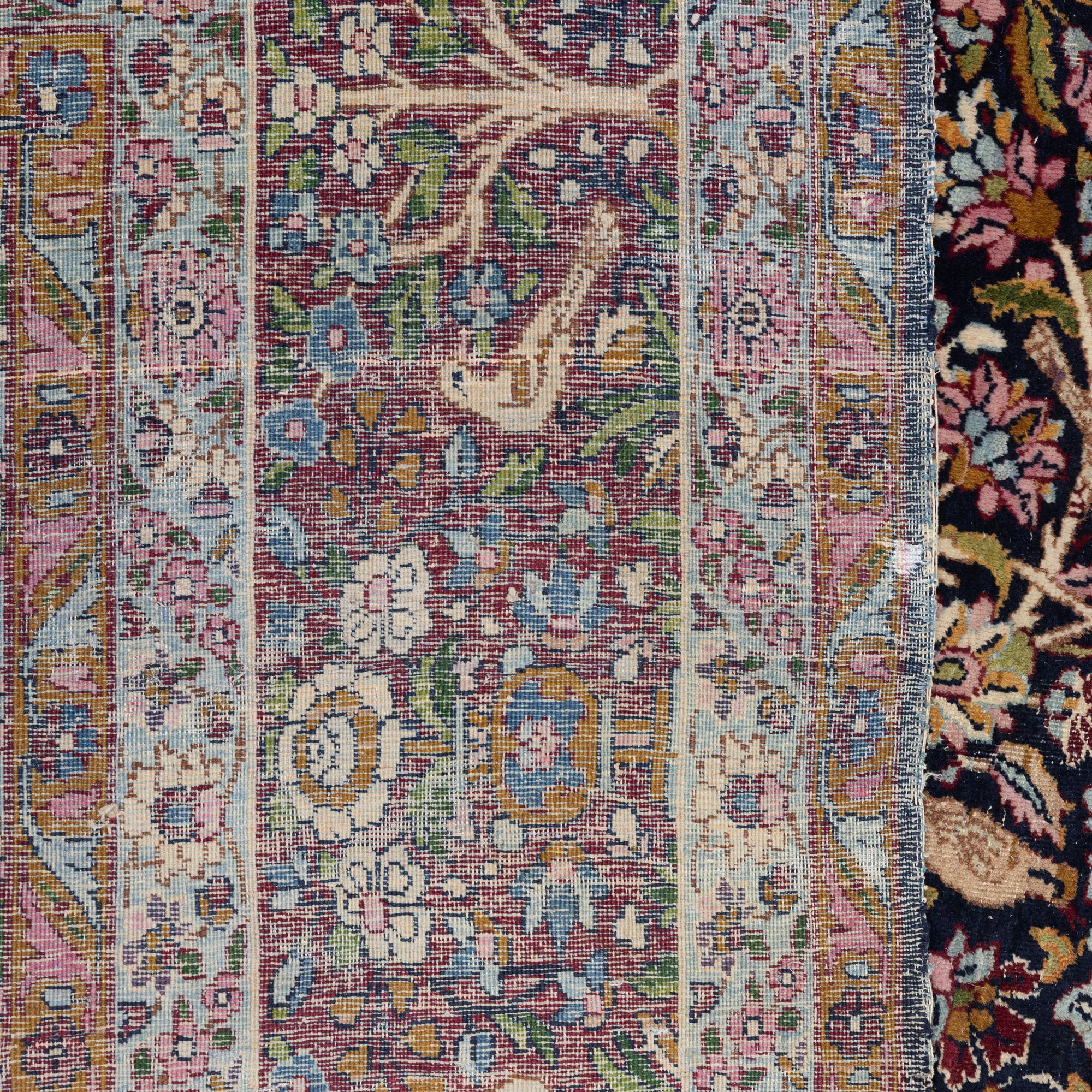 A carpet, Antique/semi-antique Kerman, ca 340 x 220 cm.