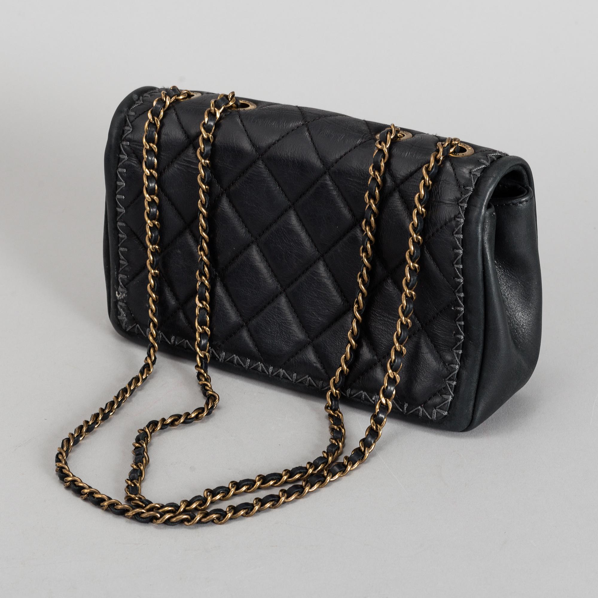 CHANEL, a black quilted fabric 'Flap Bag', 2015-2016.