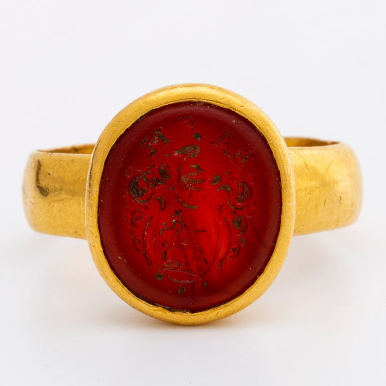 A signet carnelian ring.