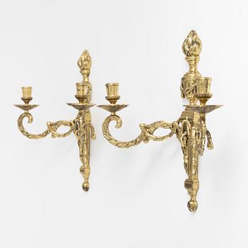 A pair of Louis XVI style brass wall sconces, mid 20th Century.