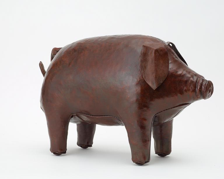 A brown leather figure of a pig by Svenskt Tenn.