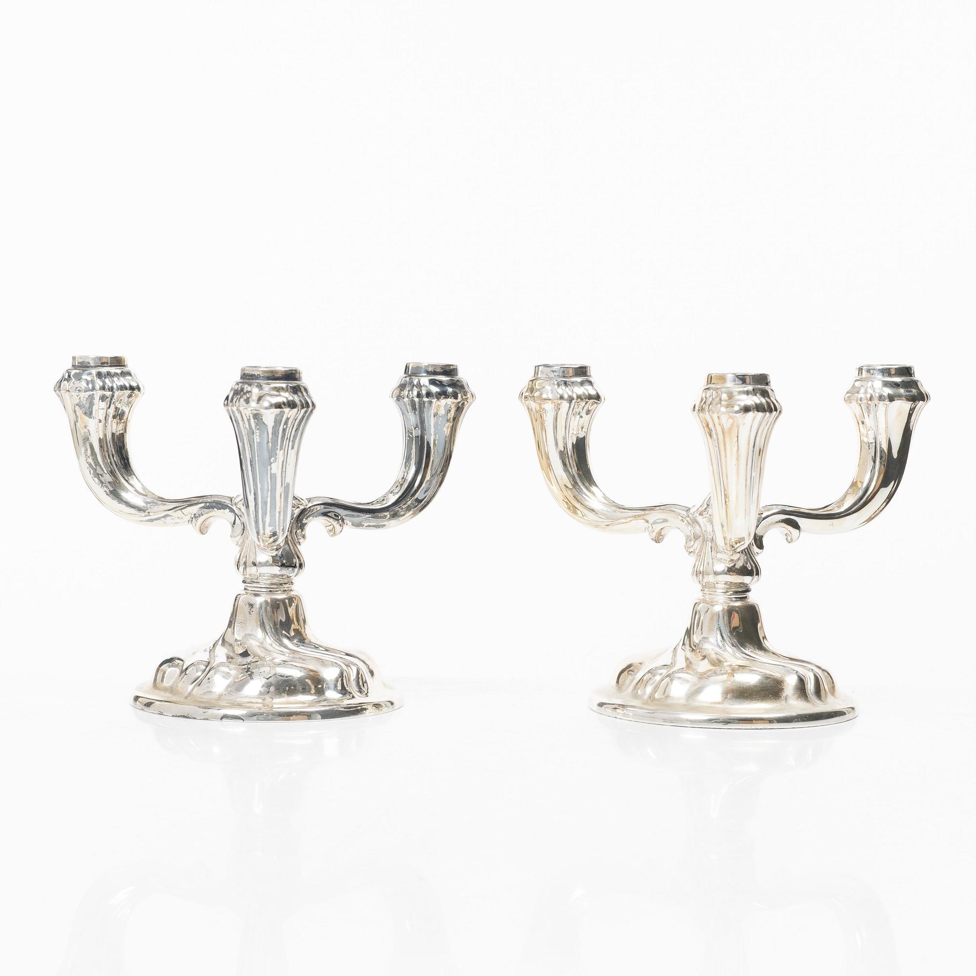 A pair of German silver candelabra, mark of Jakob Grimminger, Schwäbisch Gmünd, 20th century.